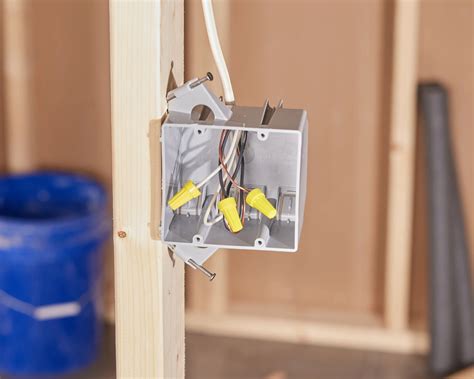 how do you attach electrical boxes to metal studs|install old work outlet box.